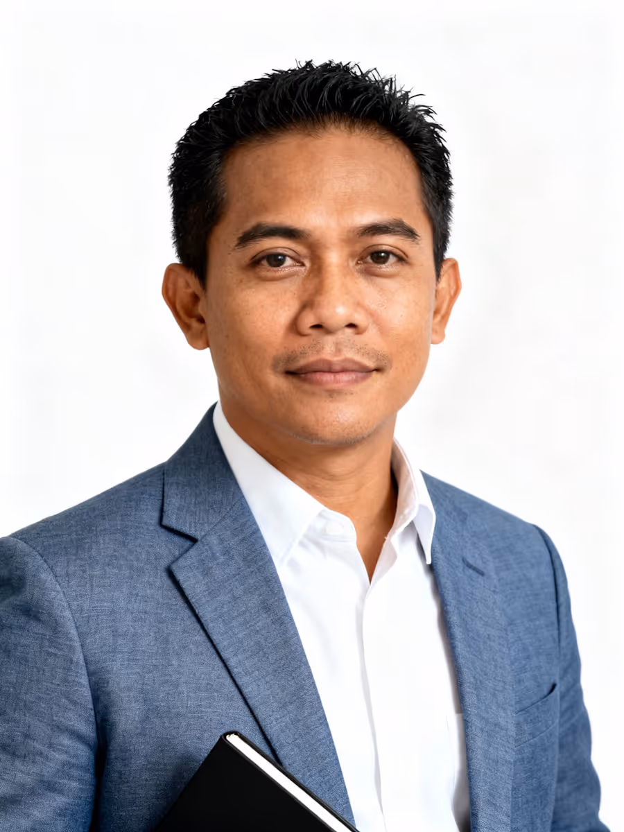 Professional portrait holding a notebook.
